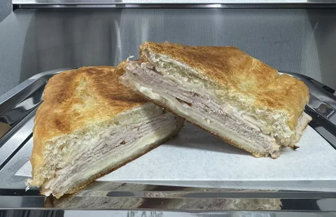 Toasted turkey and Swiss sandwich cut in half